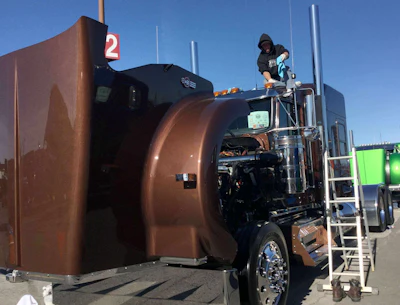 David Kuhn atop a 2017 Kenworth W900L, owned by Clay Swartzengruber of Mt. Aetna, Pennsylvania.