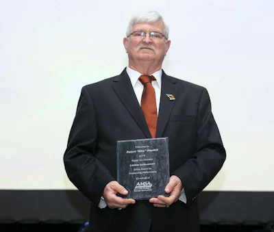 Robert Westfall with his Lifetime Achievement award at a formal ceremony by the American Moving & Storage Association. (Image Courtesy of AMSA)
