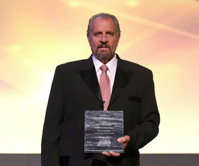 Ronald Kappellusch with his Special Commodities award at a formal ceremony by the American Moving & Storage Association. (Image Courtesy of AMSA)