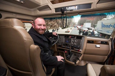 Troy Davidson sits in the Kenworth he won in 2016 through the Transition Trucking: Driving for Excellence Award. (Image Courtesy of Fastport)