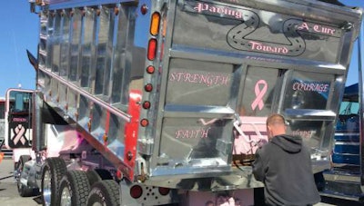 Bryant Mann works on his truck at MATS
