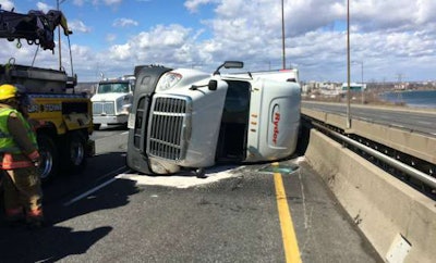 This truck was blown over on the Burlington skyway by high winds Wednesday. (Twitter photo by OPP Sgt. Kerry Schmidt)