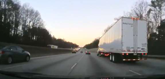 Semi truck driving on the road
