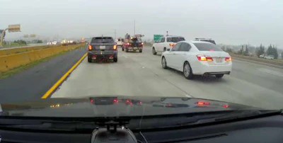Watch the white SUV changing lanes …