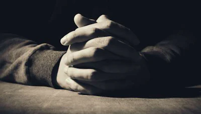 Hands folded in prayer