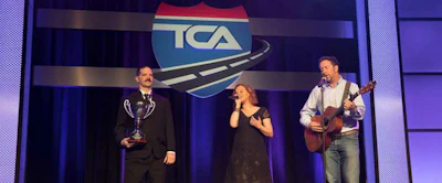 Singer/songwriter Lindsay Lawler performs her song “Highway Angel” on stage with TCA’s Highway Angel of the Year winner Daniel Sieczkarski of Rochester, New York