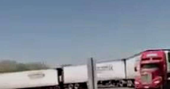 Truck pulling three trailers