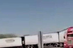 Truck pulling three trailers