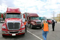 At a previous event, agents inspect trucks. (Image Courtesy of Alabama Trucking Association)