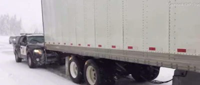 California Highway Patrol gives trucker a push in the snow