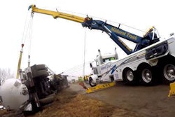 Midwest Truck crew rights a rolled over tanker.