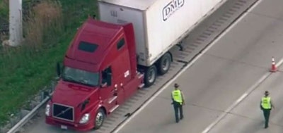 Illinois State Police investigate near the truck in which the driver was shot and killed in April on I-88 west of Chicago.