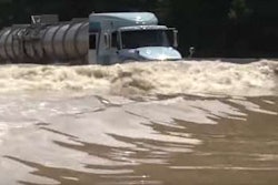 Tanker truck driving through high waters in Louisiana
