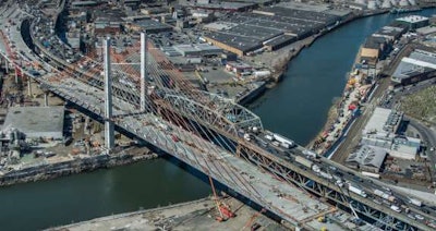 The new Kosciuszko Bridge (left) and the old span in New York City.