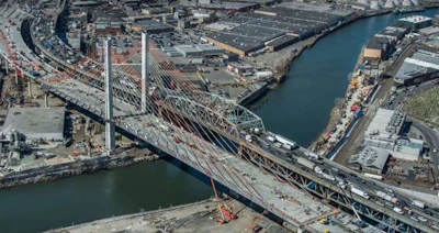 The new Kosciuszko Bridge (left) and the old span in New York City.