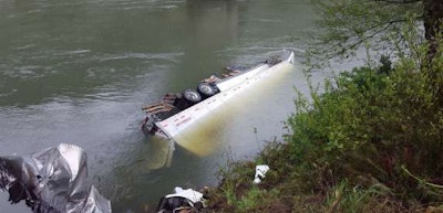 The trailer of the truck that struck a bridge in southwest Oregon fell into the Umpqua River. (Oregon State Police photo)