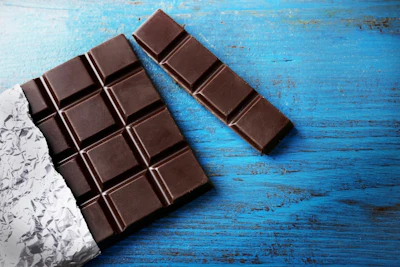 Dark chocolate helps release serotonin and relaxes the blood vessels of the cardiovascular system, both of which help fight depression and lift your mood.