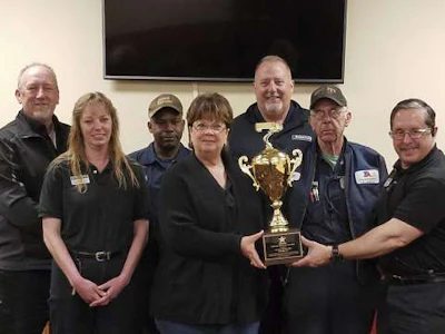 Willington TA Truck Service team with Landstar Trophy (Photo: Business Wire)