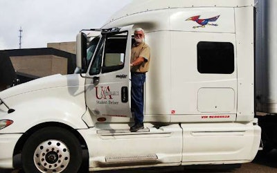 Jerry Baldridge, a CDL instructor for the Stuttgart campus’ program, stands with one of the program’s trucks. (Image Courtesy of Phillips Community College of the University of Arkansas)