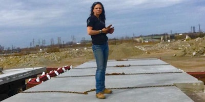 Rebekah Meadows unchaining a 12-foot 4-inch wide wall panel. (Image Courtesy of Rebekah Meadows)