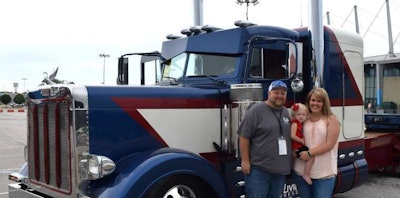 Terry Aslinger with his wife, Kasey, and their daughter, Jolie, at the 37th Annual SuperRigs show in Tulsa, Oklahoma.