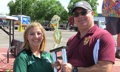 Amanda Rivera, left, receives her Rookie of the Year trophy from Sgt. Dave Kucera of Colorado State Patrol. (Image Courtesy of Colorado Motor Truck Association)