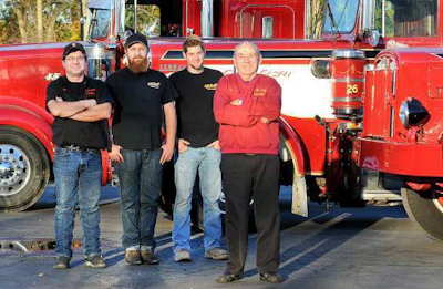 Richard Smith Sr. (right) whose father founded the family trucking business in Plumstaedville, is retiring and officially handing the business down to his son, Richard Jr (left), and grandsons, Robby and Kevin. (Photo by Art Gentile/The Intelligencer)
