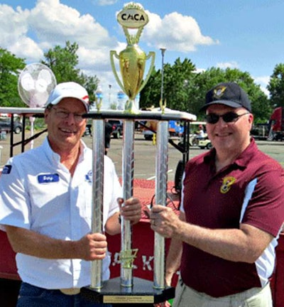 Grand champion Gary Plant, Walmart Transportation, receives his trophy from Sgt. Dave Kucera- Colorado State Patrol, MCSAP division (Colorado Motor Carriers Association photo)