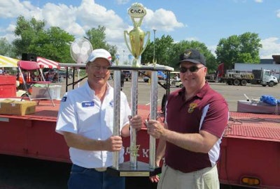 Grand champion Gary Plant, Walmart Transportation, receives his trophy from Sgt. Dave Kucera- Colorado State Patrol, MCSAP division (Colorado Motor Carriers Association photo)