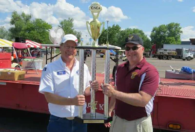 Grand champion Gary Plant, Walmart Transportation, receives his trophy from Sgt. Dave Kucera- Colorado State Patrol, MCSAP division (Colorado Motor Carriers Association photo)