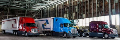 Three semi trucks parked
