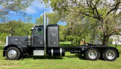 Christine Treviranus’ 1985 Peterbilt 359 was completely original when she bought it. She’s had the frame sandblasted and repainted, and is working on redoing the interior herself.