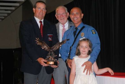 Don Logan, left, accepts his grand champion award. (Image Courtesy of Kansas Motor Carriers Association)