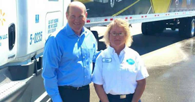 Lisa Buhrow (right) took former U.S. Representative Reid Ribble (left) for a ride along. (Image: Women In Trucking)