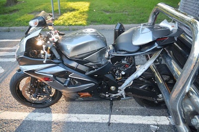 2006 Suzuki motorcycle wedged under the tractor trailer bumper in Liverpool, New York (Onondaga County Sherri’s photos)