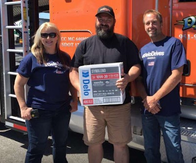 Lisa Kelly (left) and Edgar Hansen (right) with Game Changer Road Trip winner trucker James E. Clark.