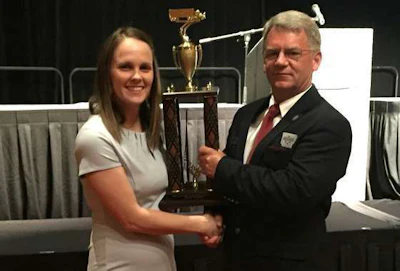 Larry Rhein, right, received the Grand Champion trophy.