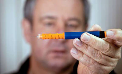 Man Treating his Diabetes with Insulin
