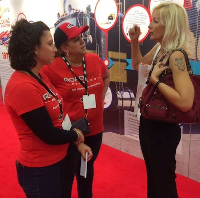 Brita Nowak (right), last year's Overdrive's Most Beautiful Trucker winner, at the RoadPro booth...