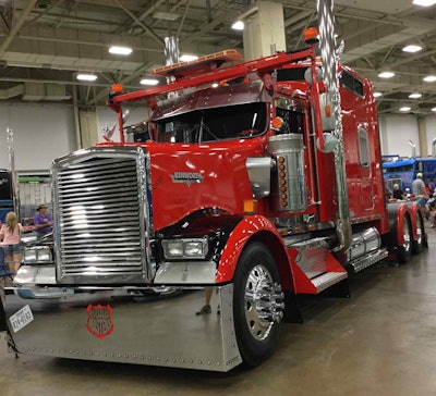 'Cherry Bomb' is a 1999 Kenworth mobile home toter with a 475/550 Cat and 10-speed Fuller...