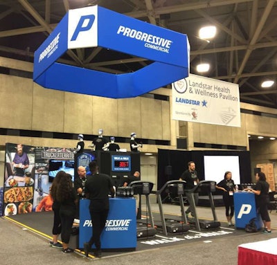 Exhibitors at the Progressive booth prepare to welcome attendees at the GATS Landstar Health &...