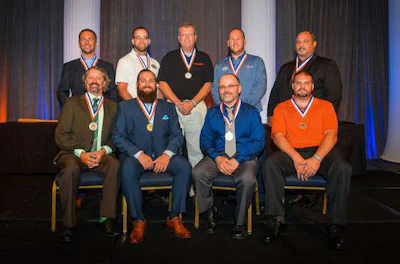 From left to right rear: Gary Noyes, Adam Caughey, Glenn Anderson, Matt Baker, and Larry Wilson. From left to right front: Danny Duke, Anthony Garcia, Joaquin Cuadras, and Andrew Spindler.