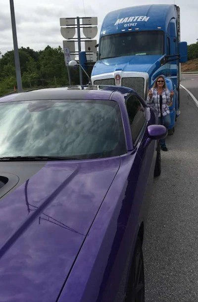 Dunn is a sports car enthusiast and owns a purple Dodge Charger, pictured in the bottom lefthand corner.