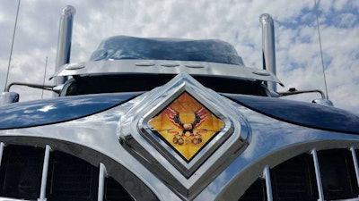 An eagle emblem is on the hood of the truck.