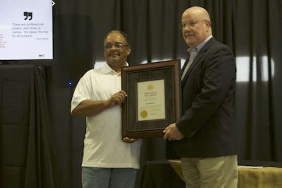 Redmon, left, was presented a Certificate of Achievement by Alabama Trucking Association’s Tim Frazier.