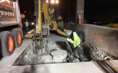 Workers creating more bridge clearance for trucks on I-278 in Queens, New York
