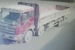 woman-under-truck