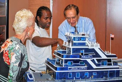Matthews discusses the boat’s details with Don and Barbara Daseke. (Photo by Greg Hirsch/Image Courtesy of Daseke)