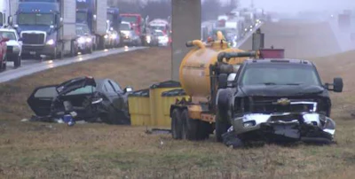Traffic was tied up for more than an hour Tuesday following a two-vehicle crash that spilled cash over part of I-74 in Illinois.