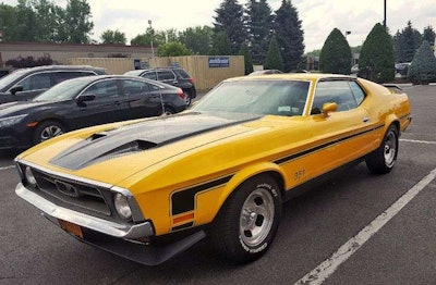 Sterritt-Smith’s 1971 Mustang is bright yellow with black details. (Image Courtesy of Jennifer Sterritt-Smith)